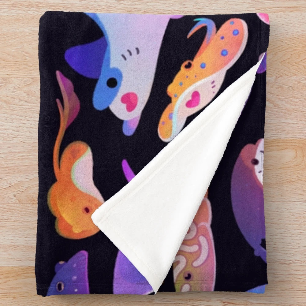 Plush blanket featuring a vibrant design of various ray and marine life species