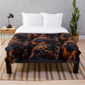 Plush blanket with navy blue, orange, and yellow patterned lion figure