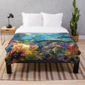 Plush blanket featuring a colorful underwater seascape with marine life