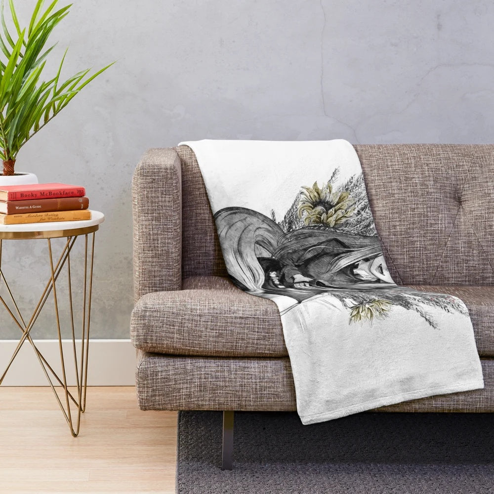 Plush blanket with nature-inspired motifs like sunflowers and berries