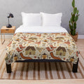 Plush blanket with nature-inspired pattern featuring woods, leaves, and acorns