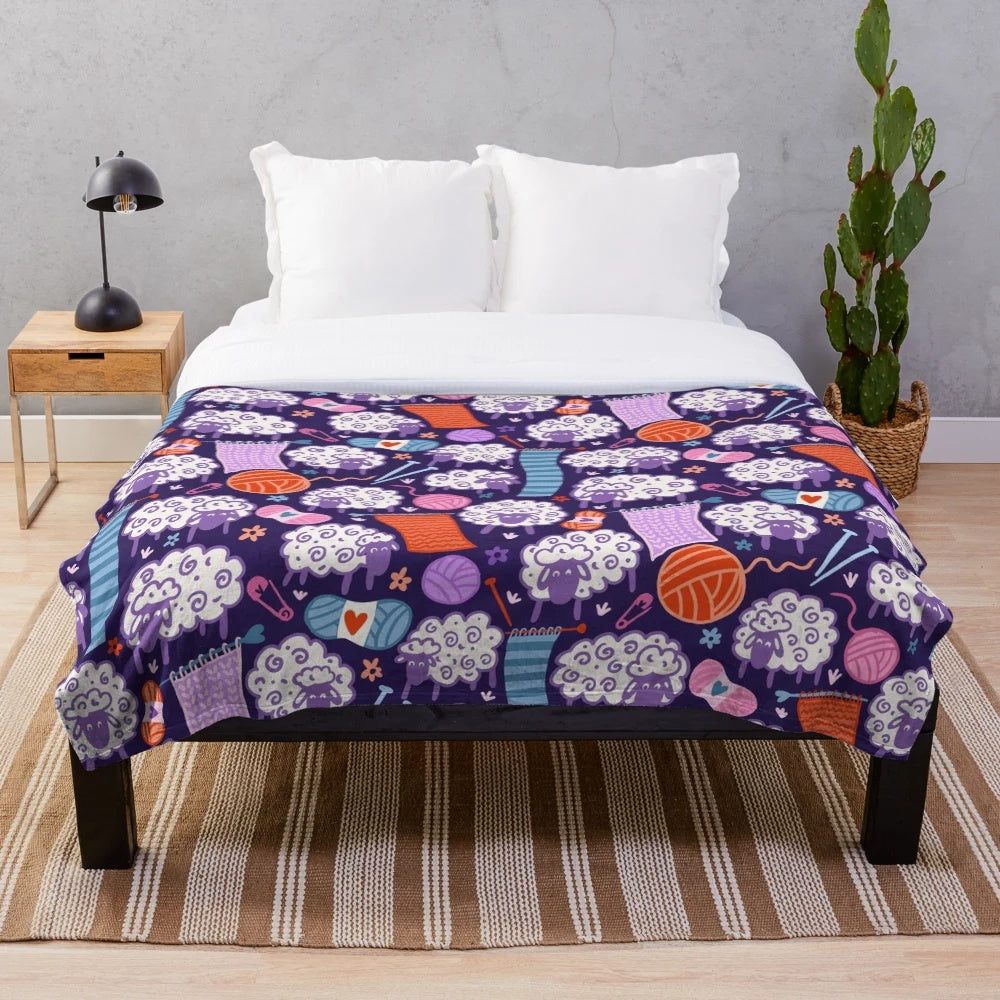 Soft and plush blanket featuring a woolly sheep and knitting design