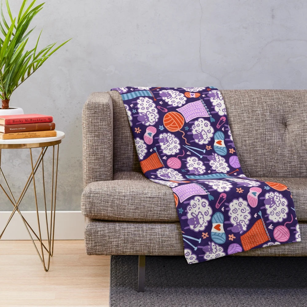 Soft and plush blanket featuring a woolly sheep and knitting design