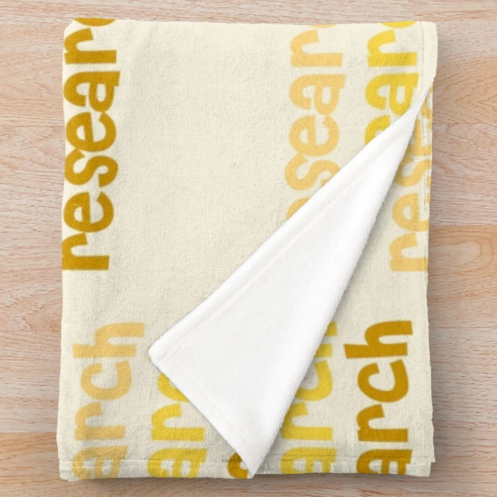 Plush blanket with yellow aesthetic and research-themed lettering