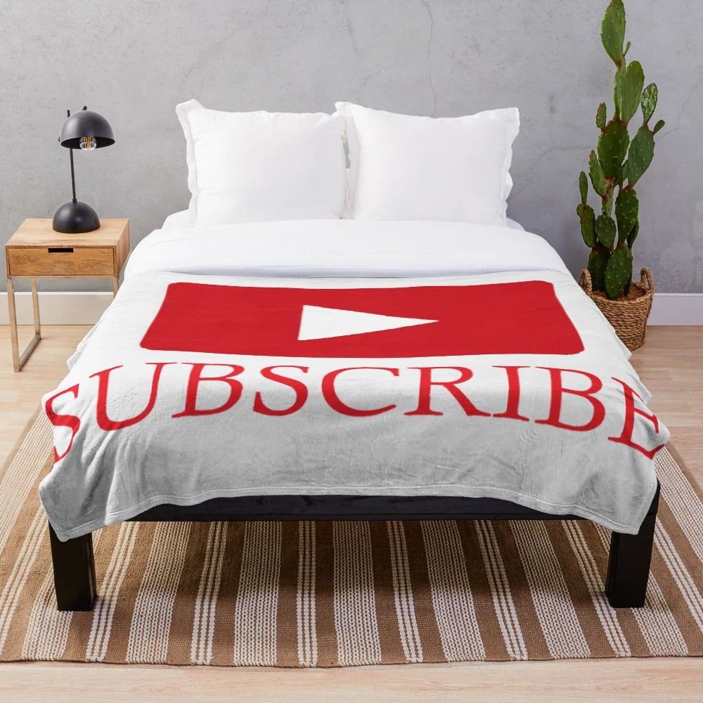 Plush blanket with youtube logo, play button, and subscribe designs