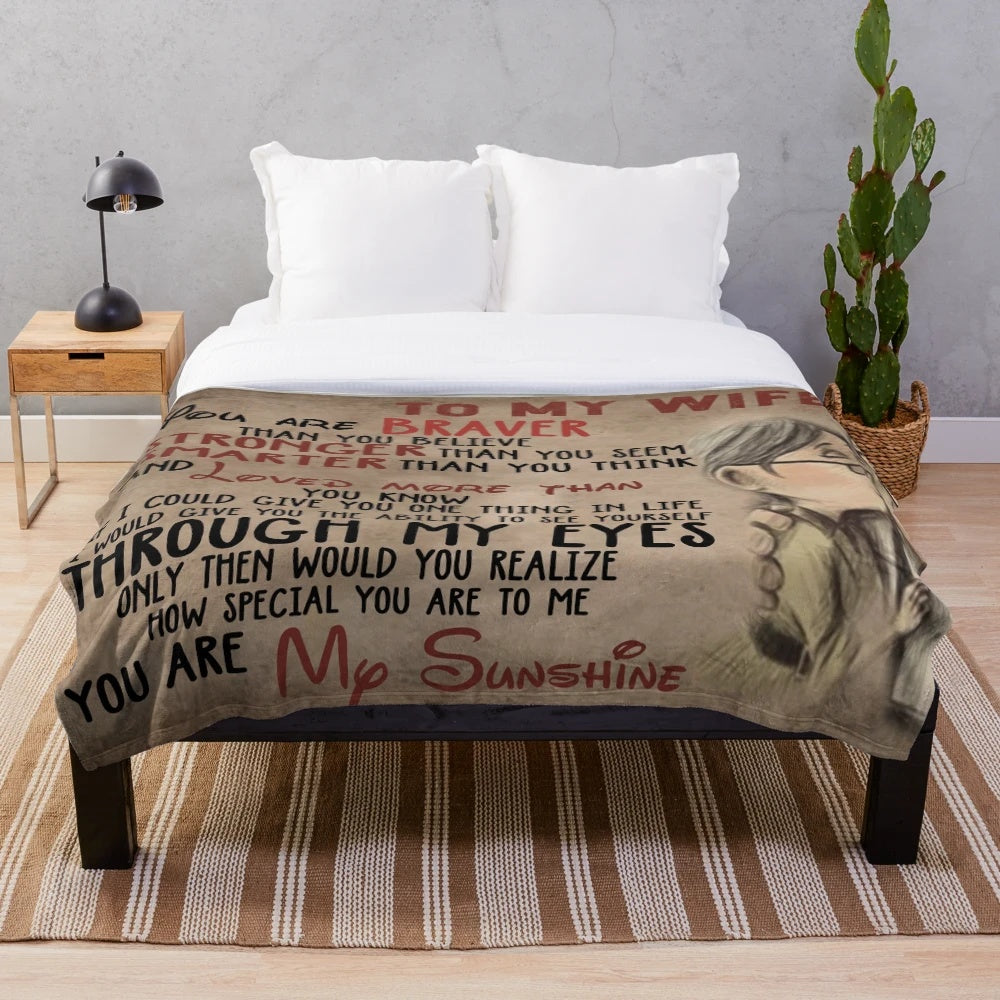 Plush blanket with inspirational message "You are braver than you believe