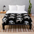 Soft plush cow print blanket for cozy home decor