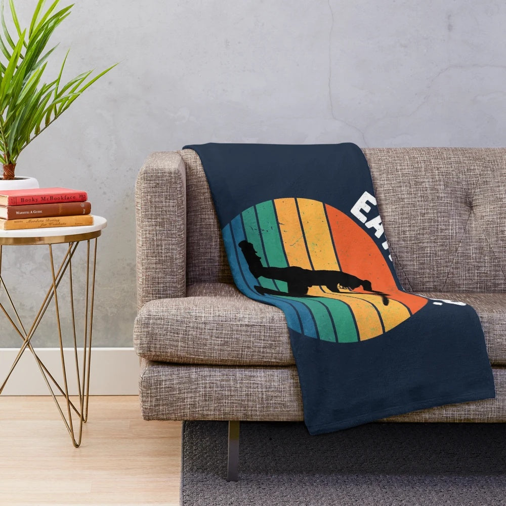 Plush blanket with "Eat Sleep Cricket Repeat" sunset graphic design