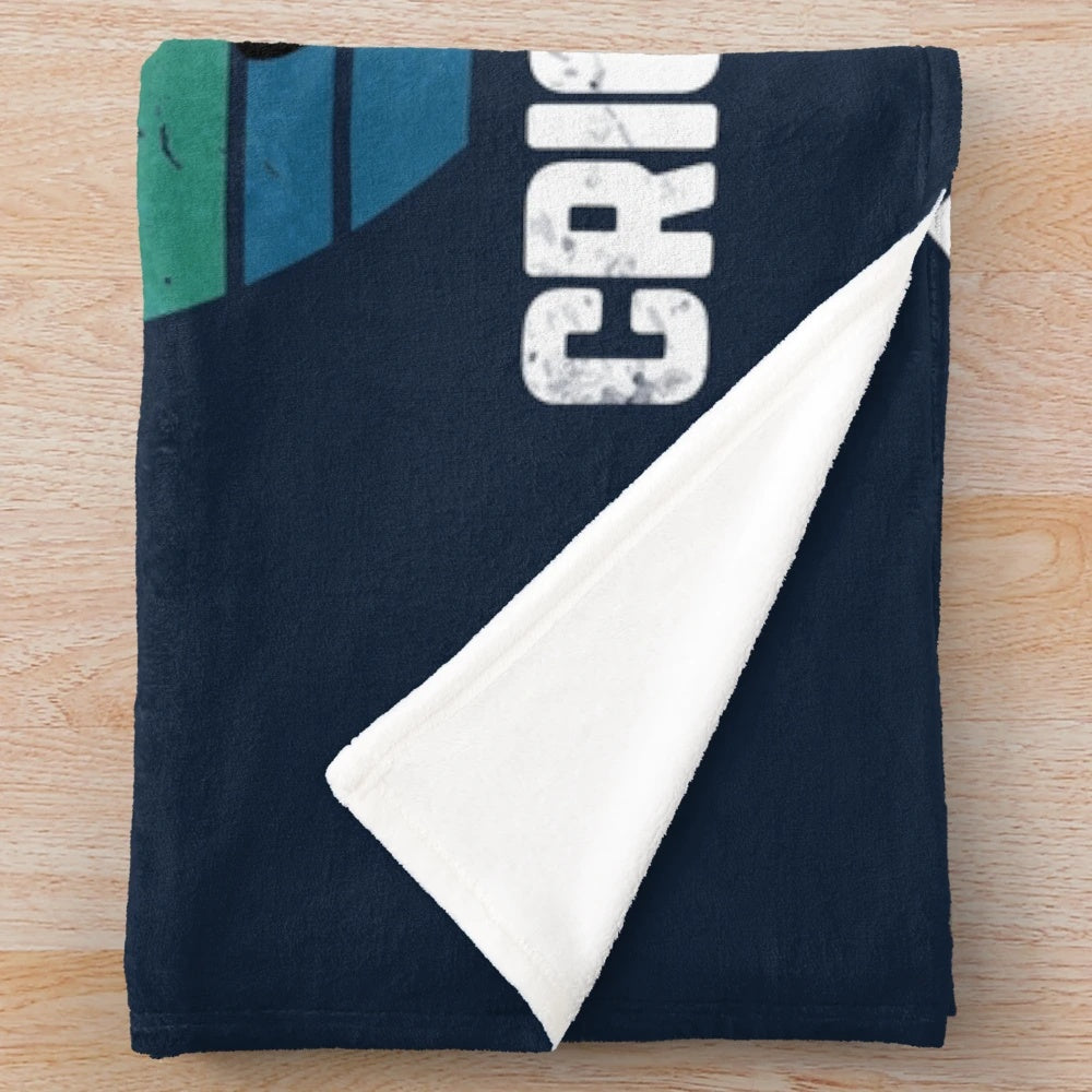 Plush blanket with "Eat Sleep Cricket Repeat" sunset graphic design