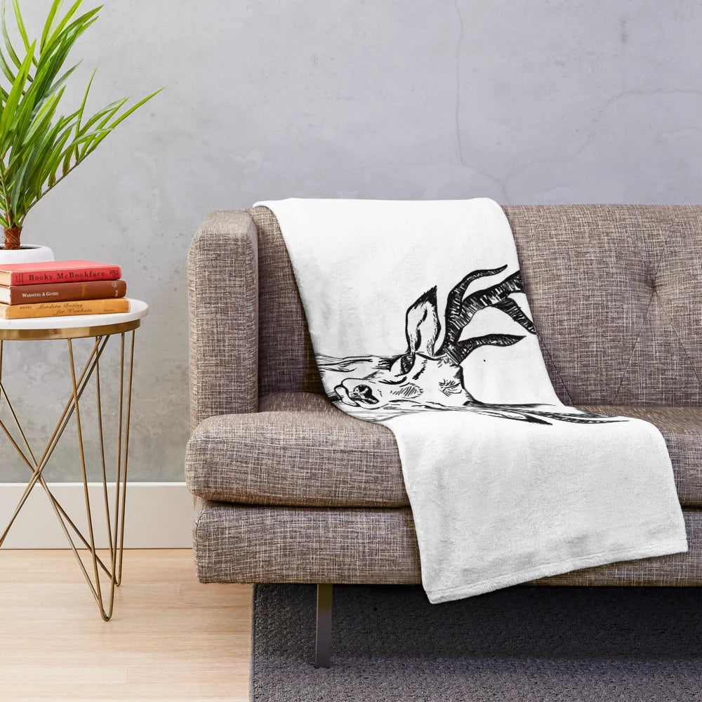Cozy plush blanket with hand drawn deer design