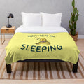 A soft, plush dinosaur-themed blanket for comfortable and relaxing sleep.