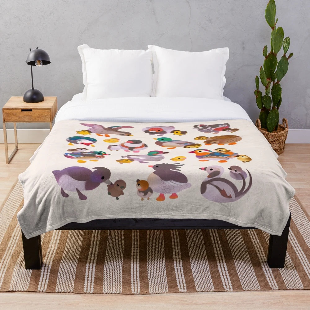 Soft and cuddly plush blanket featuring ducks and ducklings in a farmhouse-inspired design