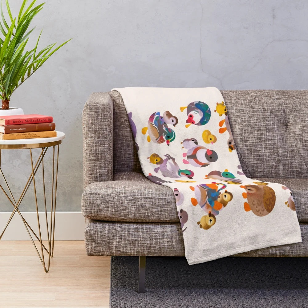 Soft and cuddly plush blanket featuring ducks and ducklings in a farmhouse-inspired design