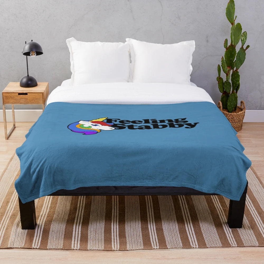 Plush "Feeling Stabby" blanket with sassy unicorn design