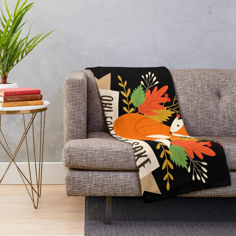 Cozy plush blanket featuring a cute fox surrounded by autumn leaves