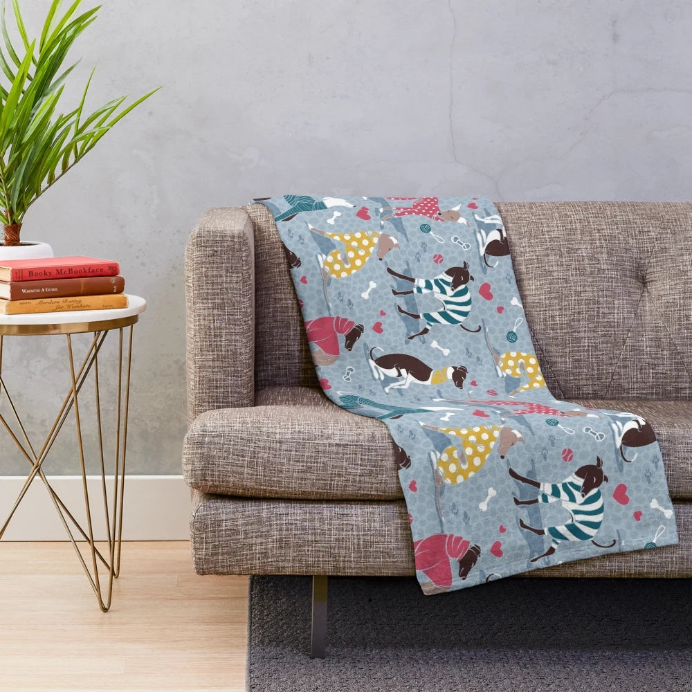Greyhounds dog illustration on a pale blue plush blanket