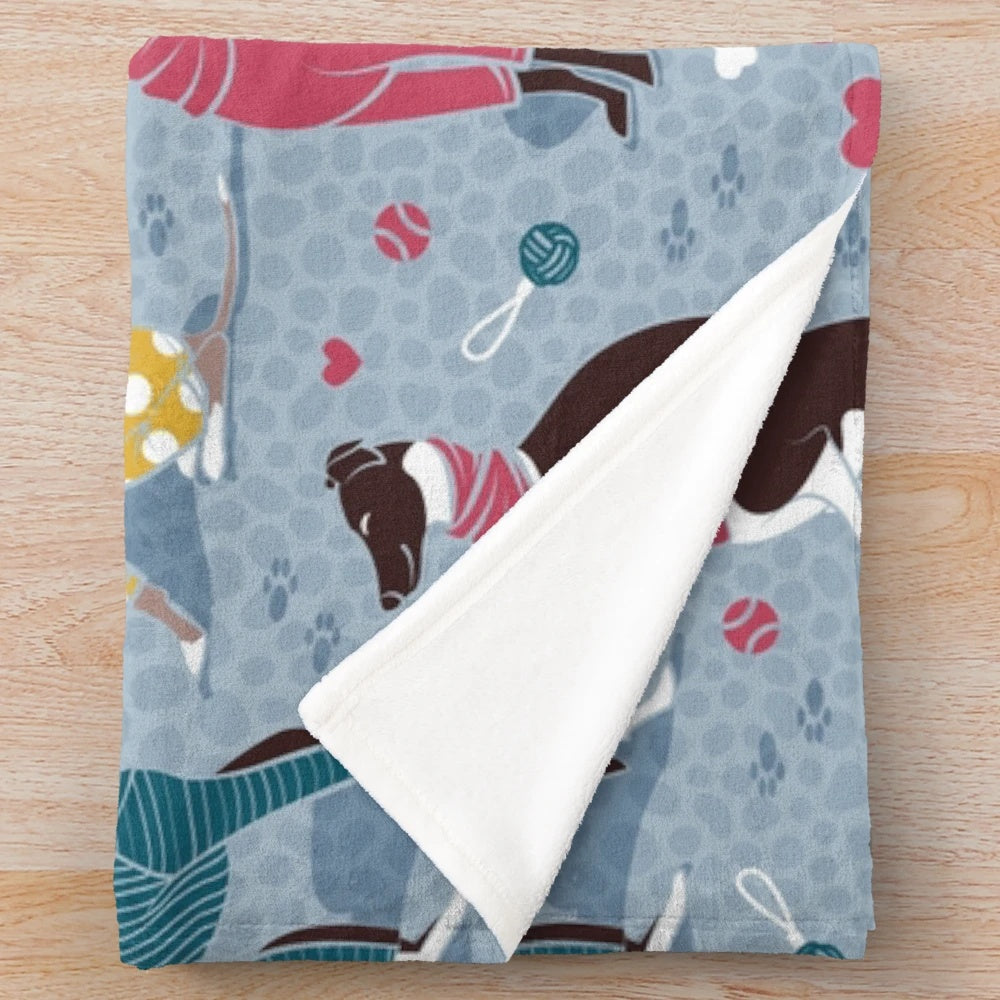 Greyhounds dog illustration on a pale blue plush blanket