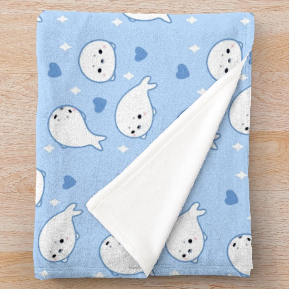 Soft and cuddly plush harp seal blanket
