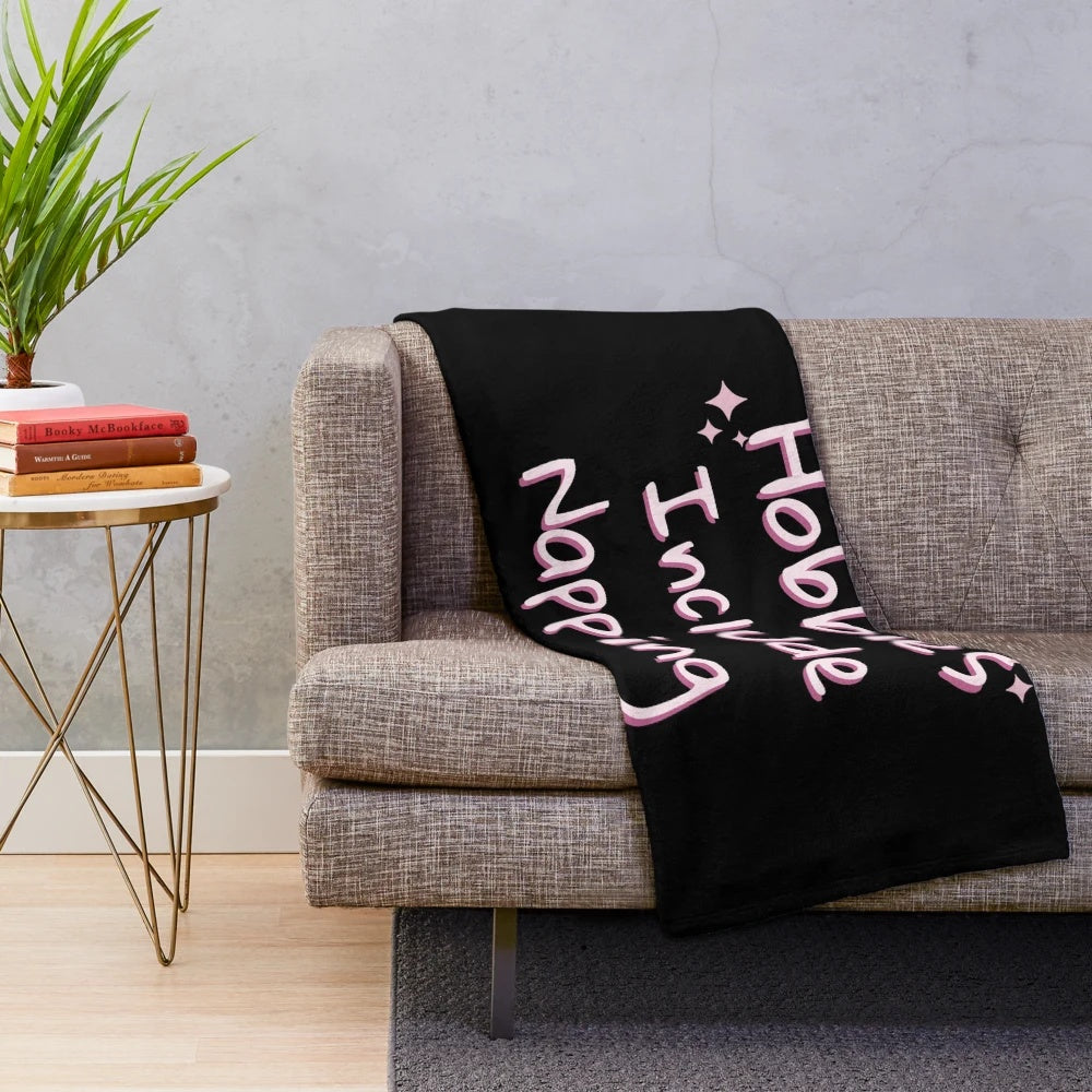 Cozy plush "Hobbies Include Napping" blanket