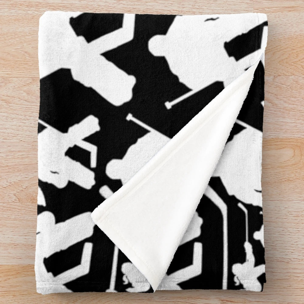 Plush hockey-themed blanket with a patterned design featuring hockey players and equipment