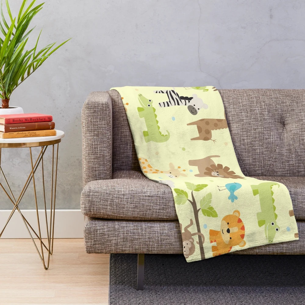 Plush jungle animals blanket featuring elephant, giraffe, and other wildlife