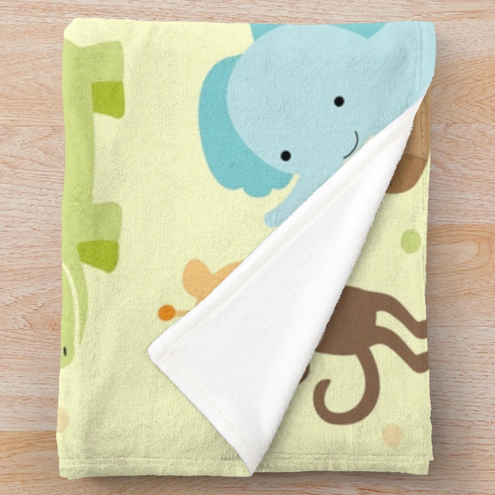 Plush jungle animals blanket featuring elephant, giraffe, and other wildlife