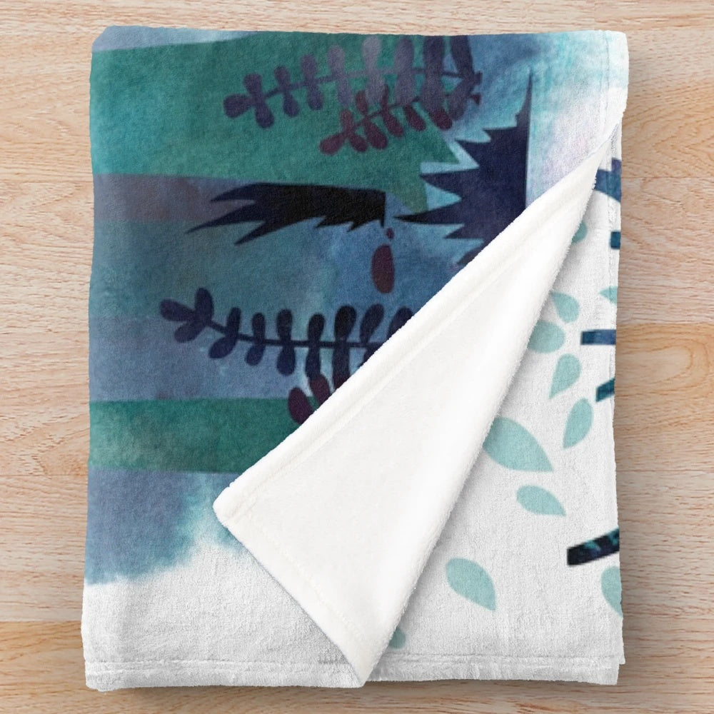 Soft and cozy plush blanket featuring a watercolor monster design, perfect for book lovers.