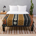 Soft plush mudcloth patterned blanket with geometric shapes and shell accents