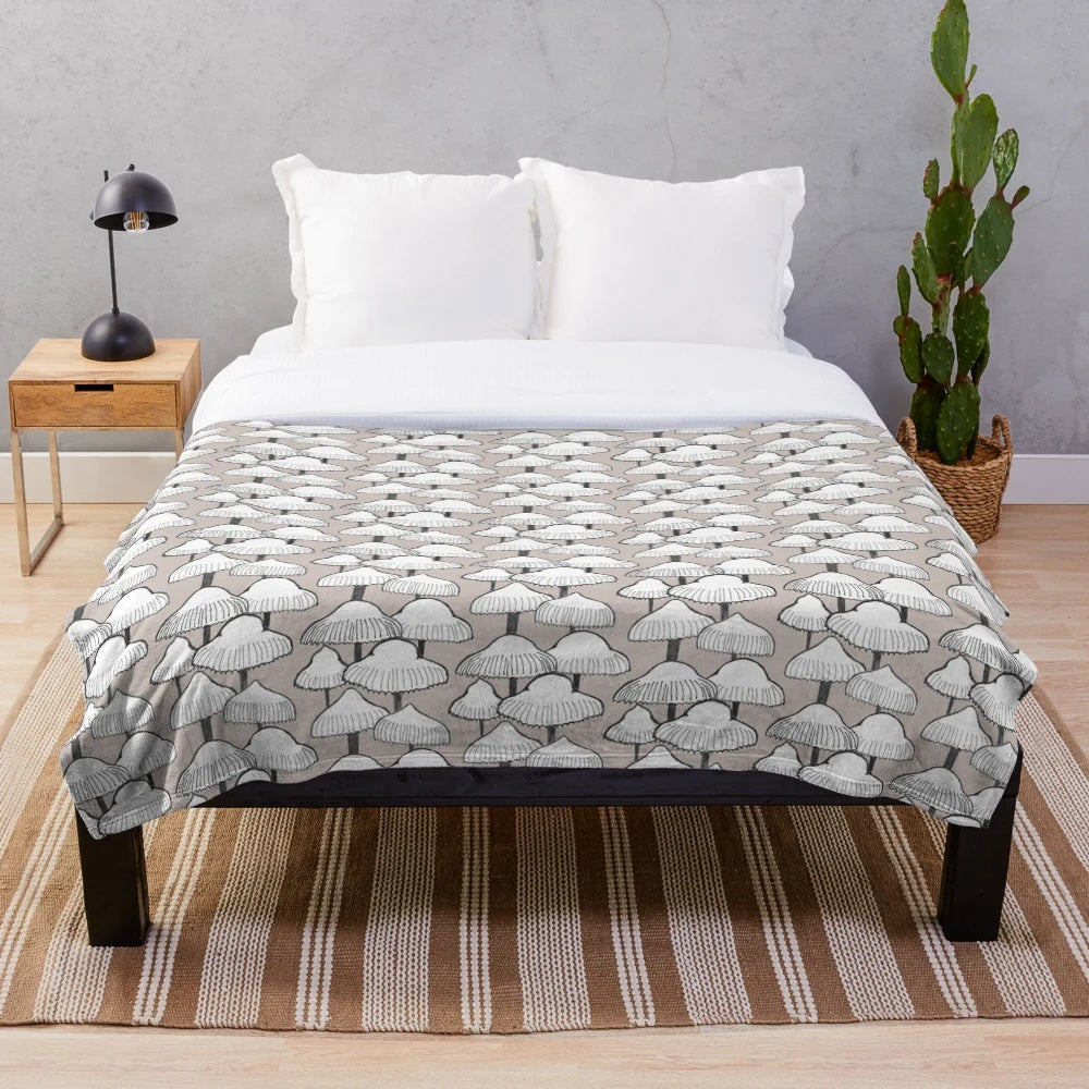 Cozy plush blanket with a neutral mushroom pattern design