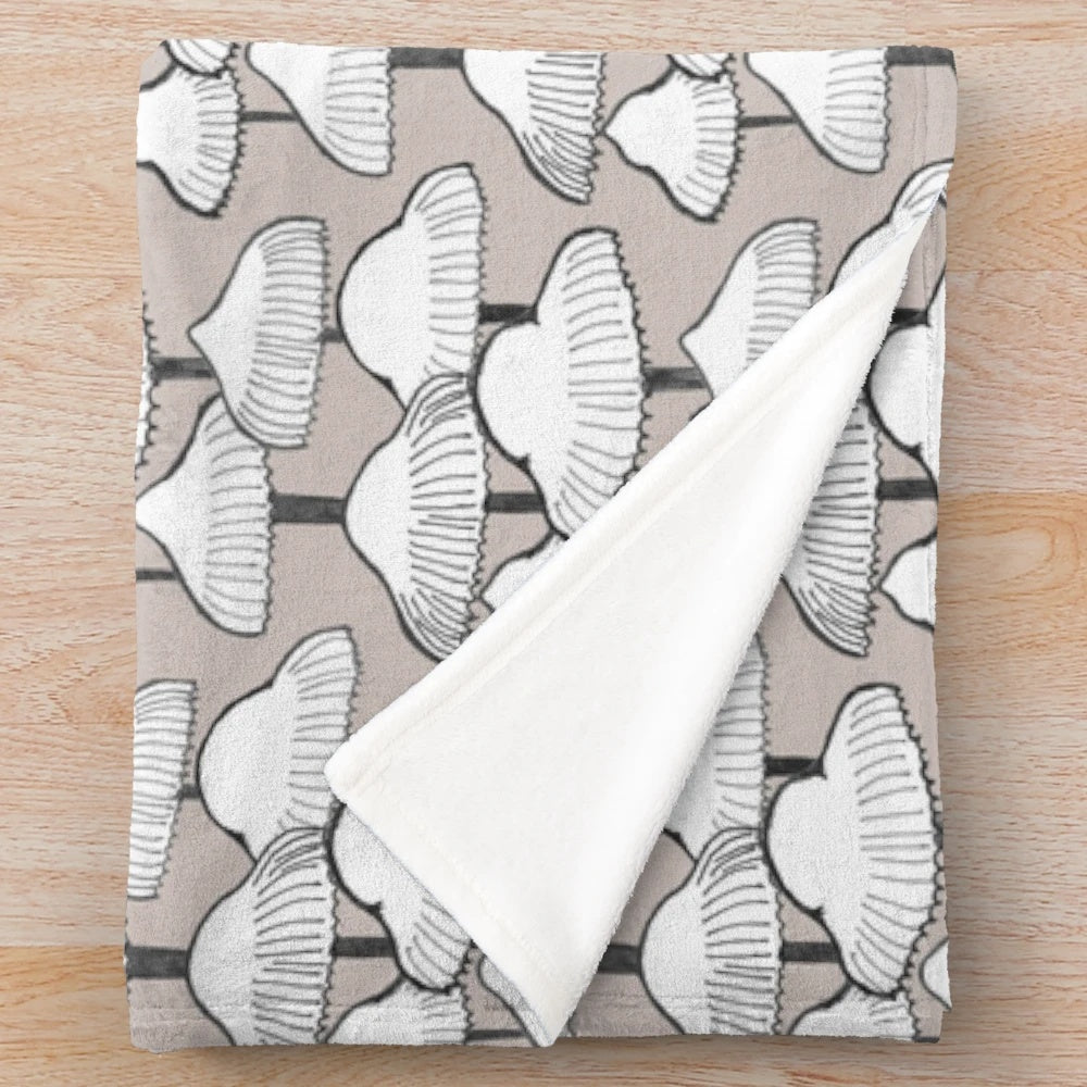 Cozy plush blanket with a neutral mushroom pattern design