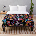 Plush mushroom-themed blanket in autumn colors