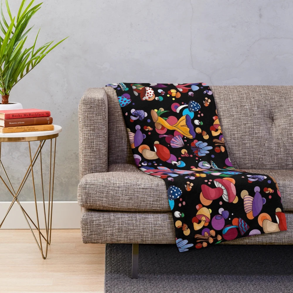Plush mushroom-themed blanket in autumn colors