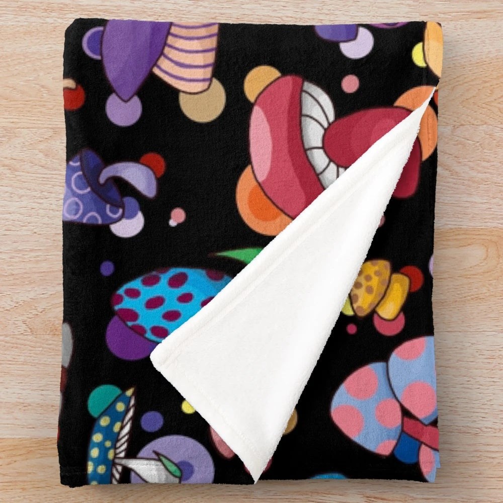 Plush mushroom-themed blanket in autumn colors