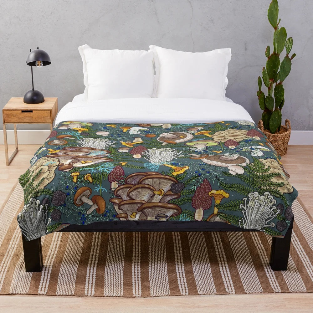 Soft and plush blanket with a botanical mushroom forest pattern