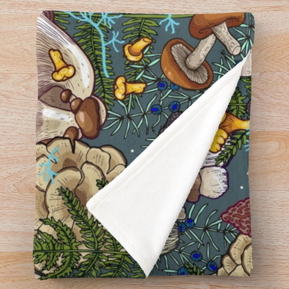Soft and plush blanket with a botanical mushroom forest pattern