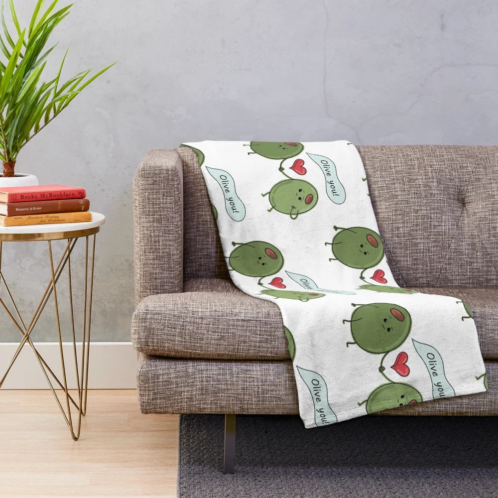 Soft and cozy plush blanket with an "Olive You!" pun design