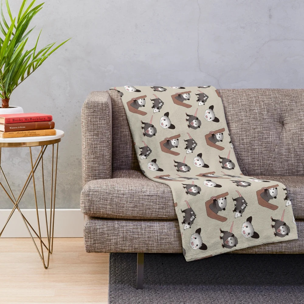 Plush opossum pack blanket with cute opossums
