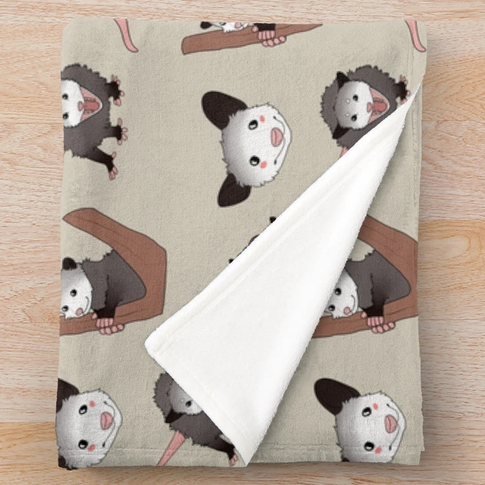 Plush opossum pack blanket with cute opossums