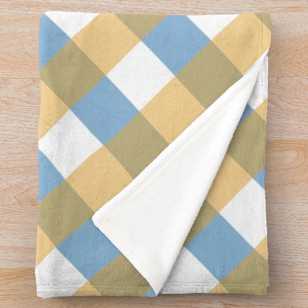 Plush plaid blanket with diagonal pattern in shades of pink and white