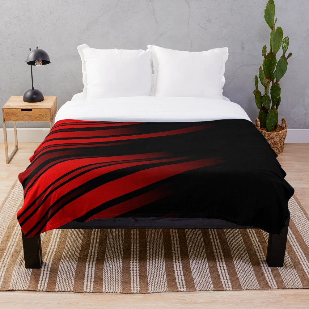 Red and black striped plush blanket with a minimalist geometric pattern