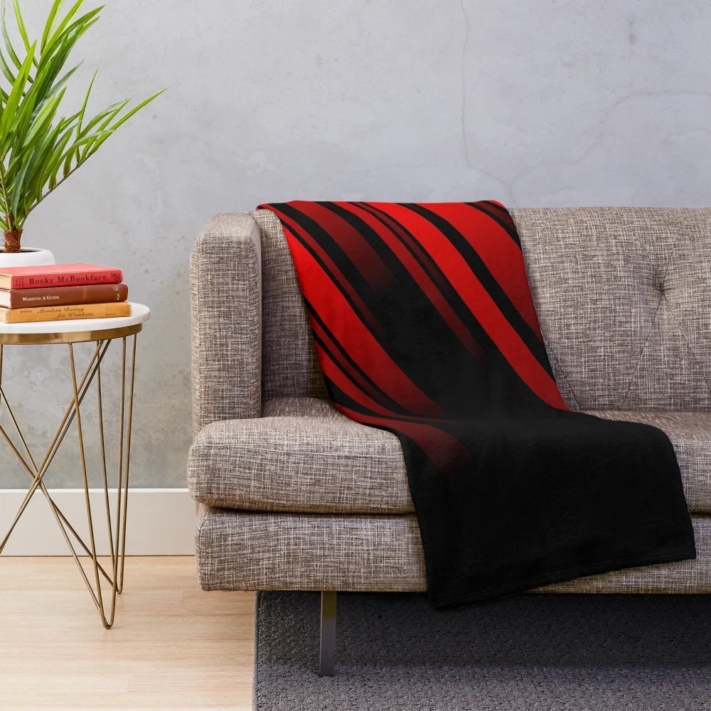 Red and black striped plush blanket with a minimalist geometric pattern