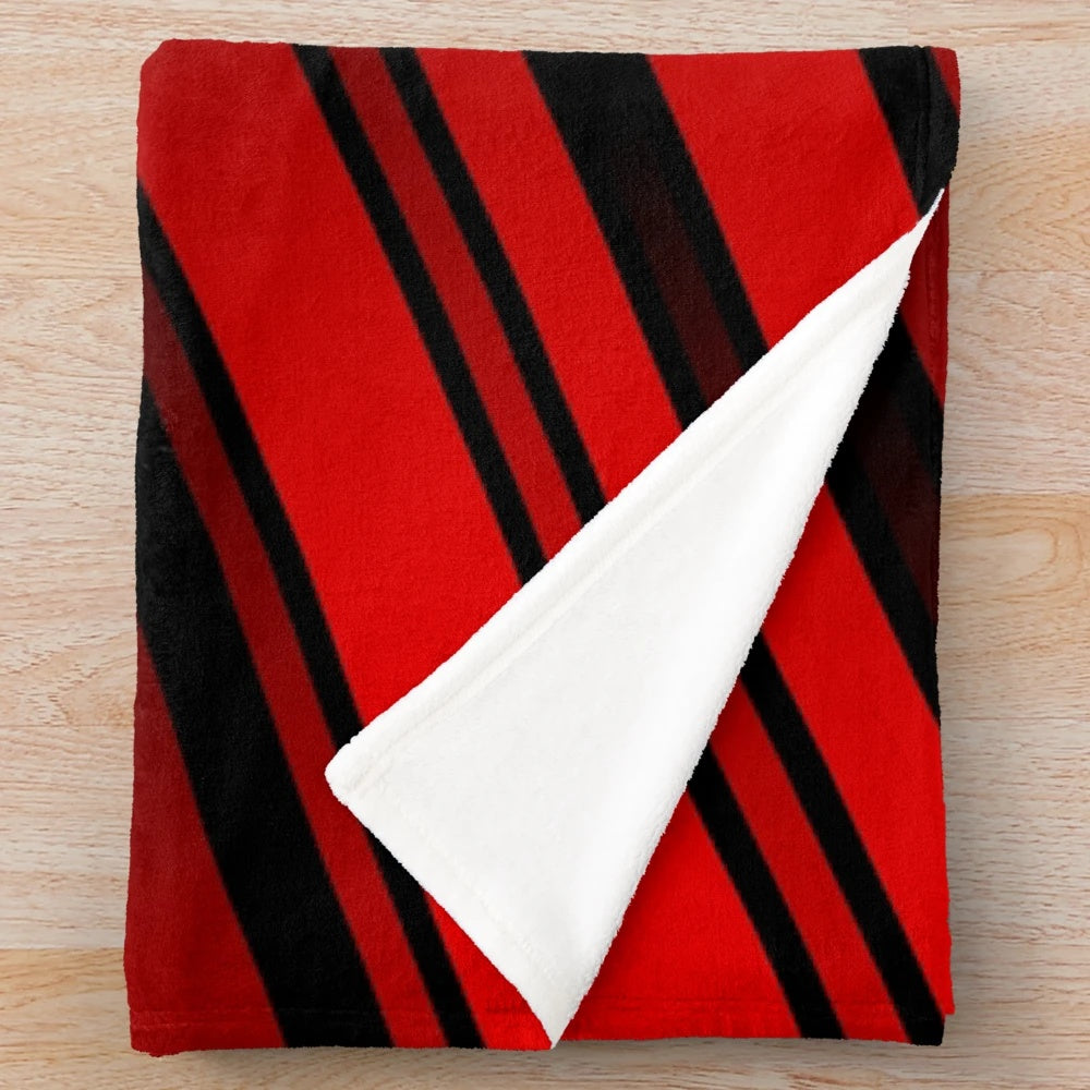 Red and black striped plush blanket with a minimalist geometric pattern