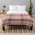 Plush tartan blanket featuring a classic Scottish pattern in pink and brown tones