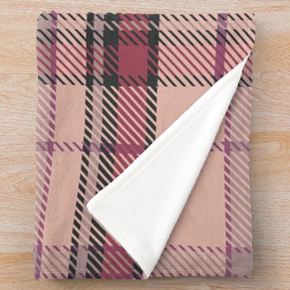 Plush tartan blanket featuring a classic Scottish pattern in pink and brown tones