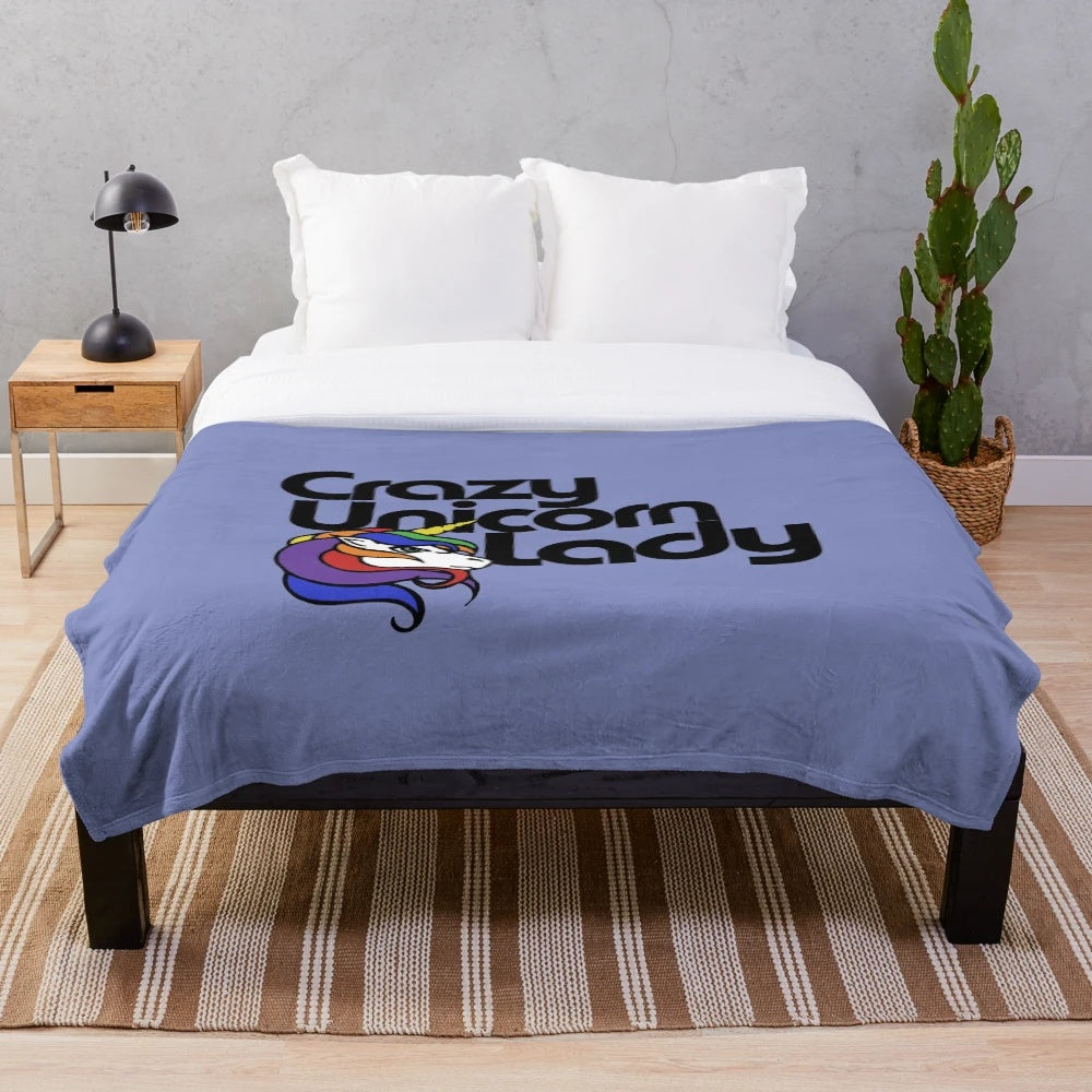 Plush unicorn blanket with rainbow colors and retro design