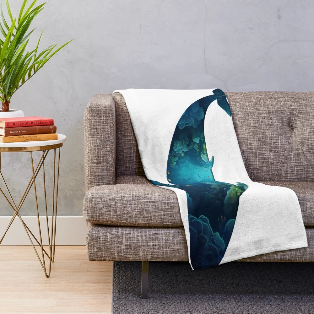 Plush whale-shaped blanket with underwater ocean scene