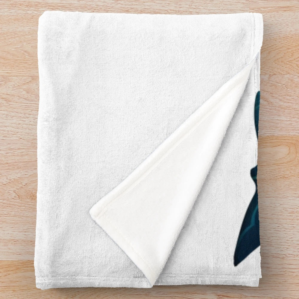 Plush whale-shaped blanket with underwater ocean scene