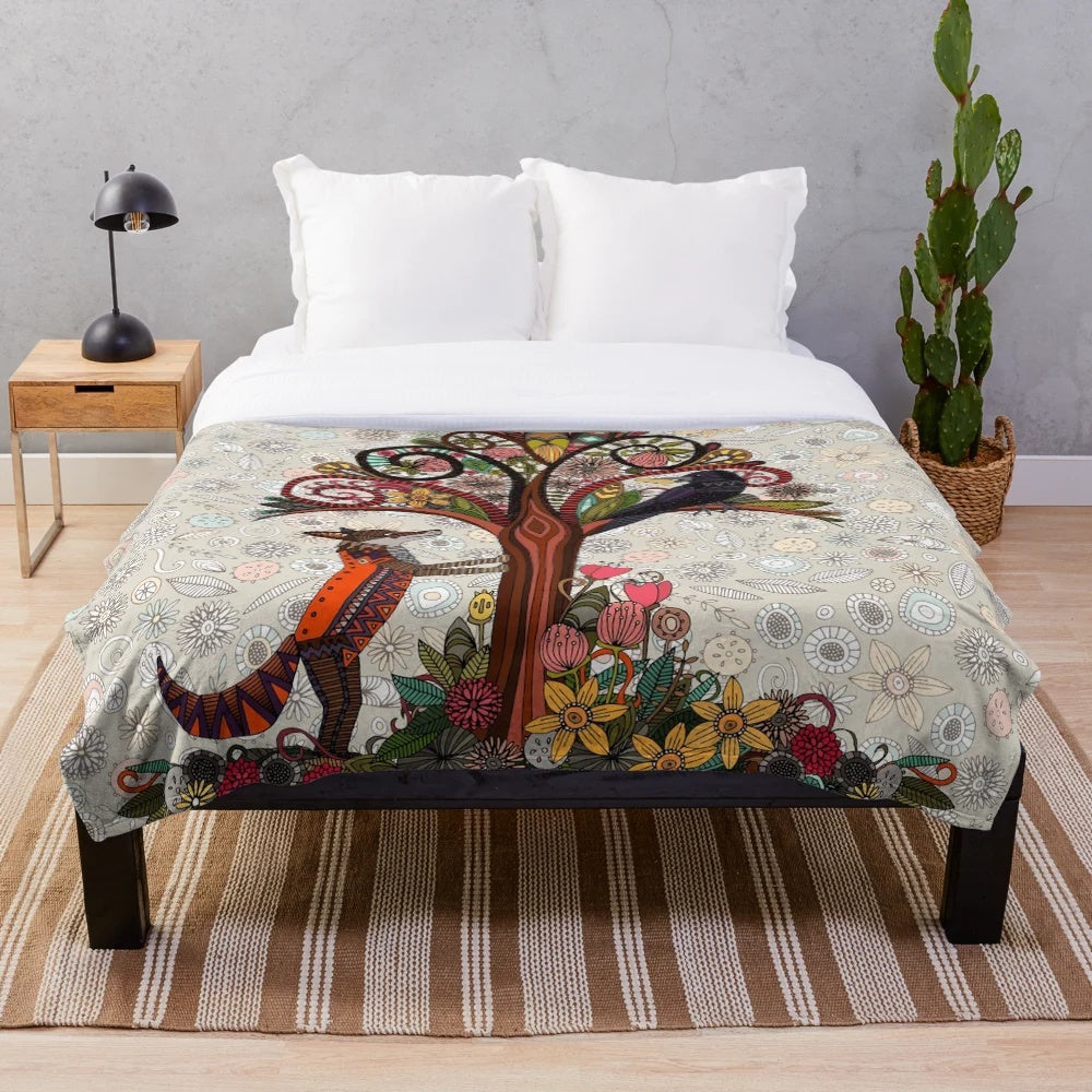 Soft and cozy plush blanket with a woodland animal and bird floral pattern