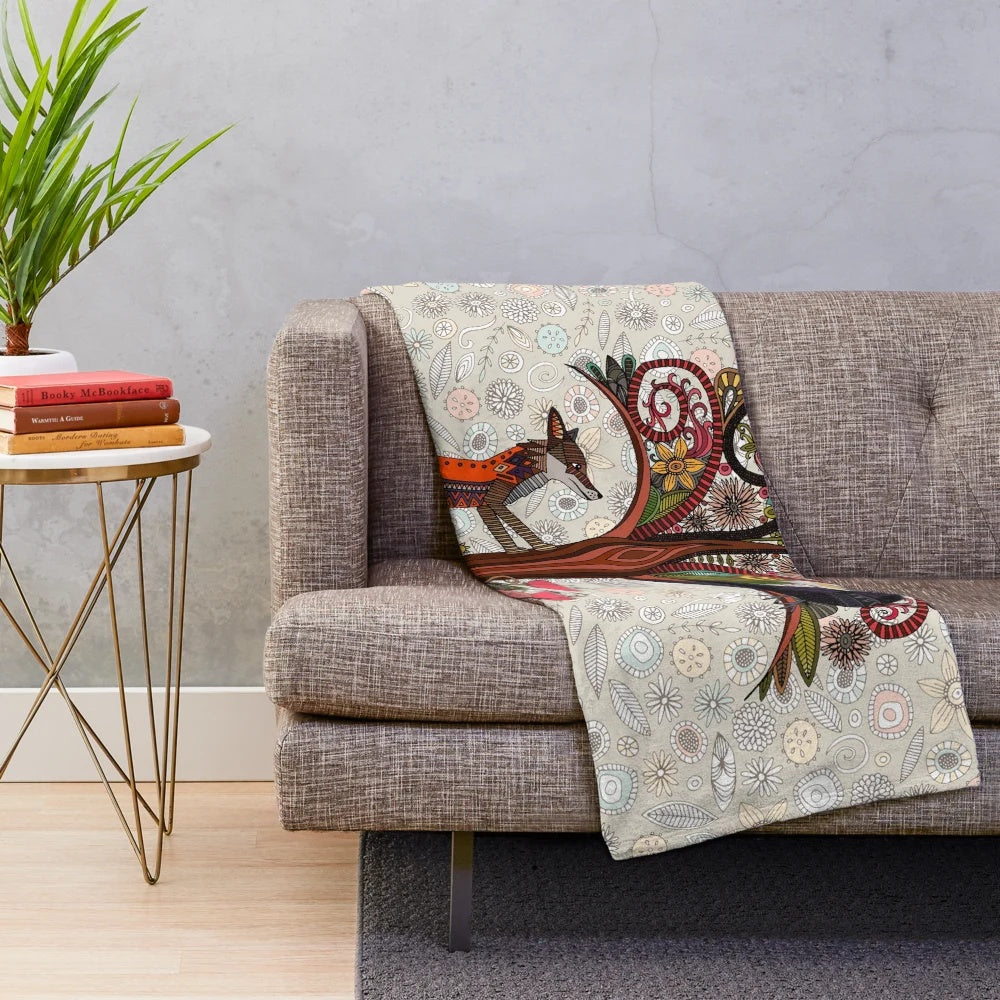 Soft and cozy plush blanket with a woodland animal and bird floral pattern