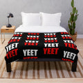 Plush yeet blanket with a distressed, vintage-inspired design